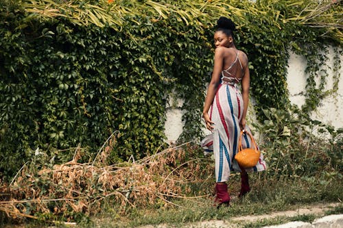 Woman Wearing White and Multicolored Overall Pants