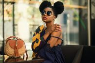 Shallow Focus Photography of Woman Wearing Gray and Yellow Spaghetti Strap Dress Sitting on Chair