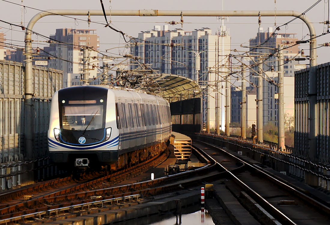 Blue and Gray Train on Rail Tracks