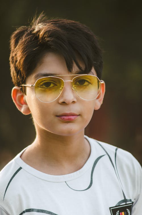 Free Portrait of a Child Wearing Sunglasses Stock Photo
