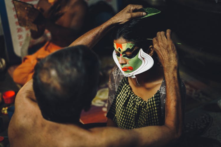 Man Painting Woman Face