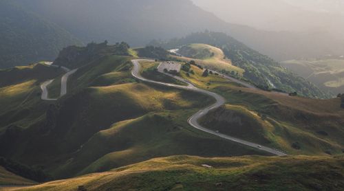 Free Aerial view of a winding road through rolling hills in the Caucasus mountains, Russia. Stock Photo