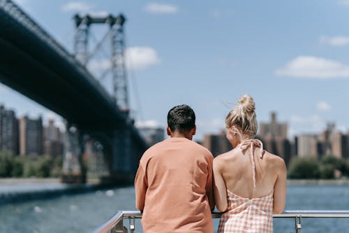 Man and Woman Standing on Boat