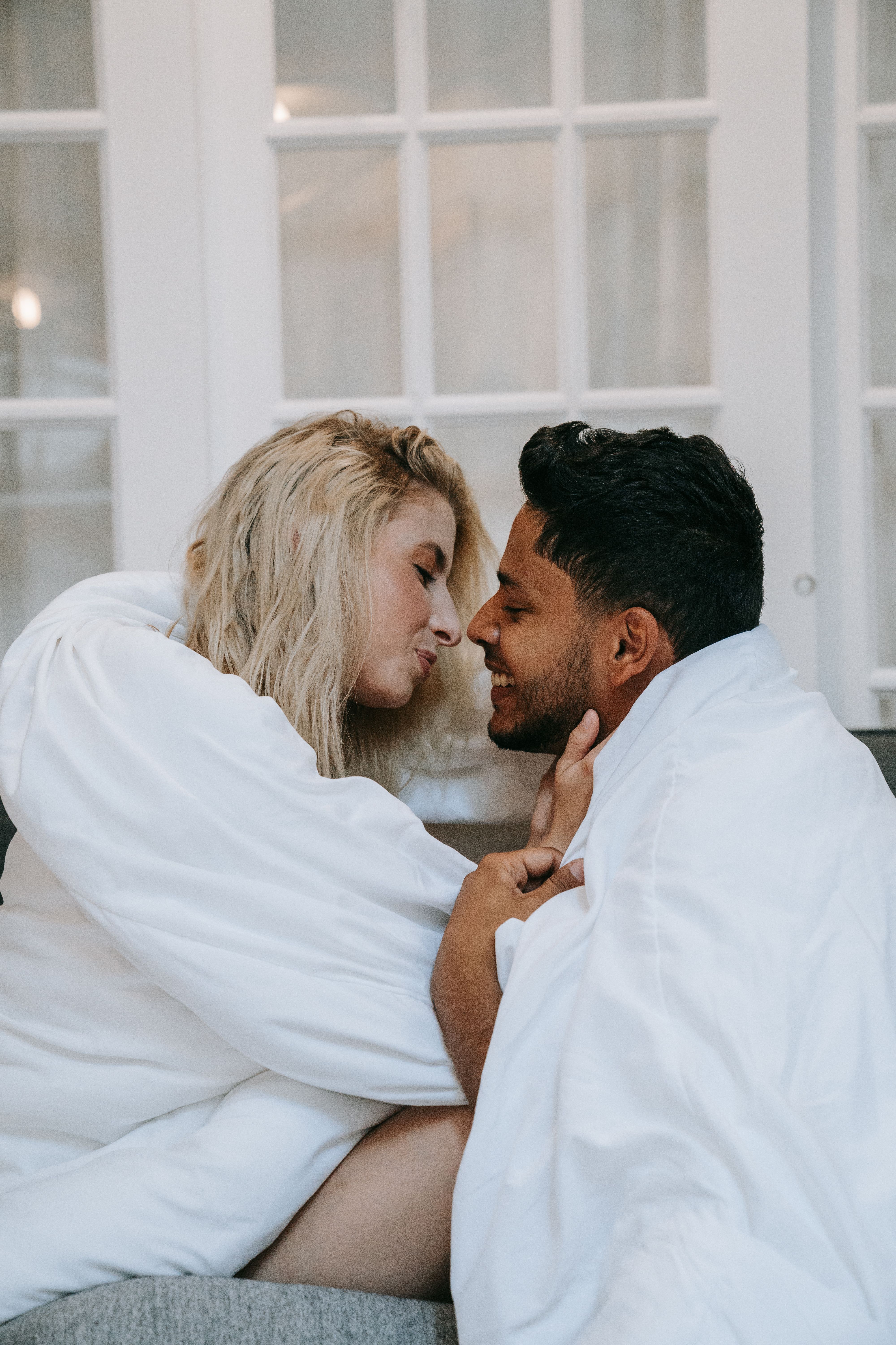 Man in White Dress Shirt Kissing Woman in White Dress · Free Stock Photo