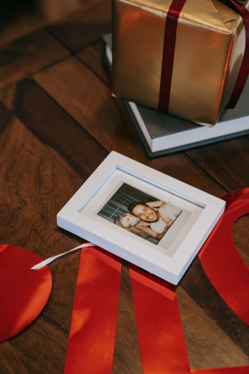 White Wooden Picture Frame on Brown Wooden Table · Free Stock Photo