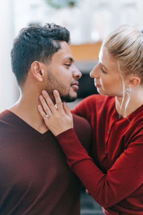 Free Close-up of a couple embracing indoors, showcasing romance and connection during the day. Stock Photo