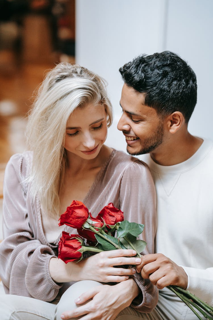 Man Giving Roses To Woman 