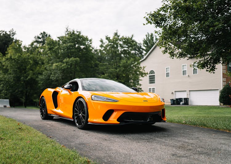 Yellow Car Parke On The Driveway