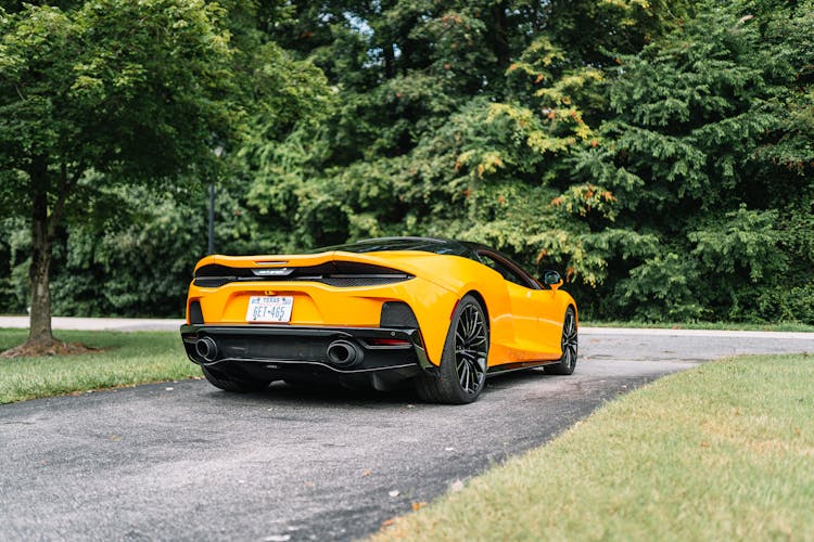 A Yellow 2021 McLaren GT Parked On A Driveway