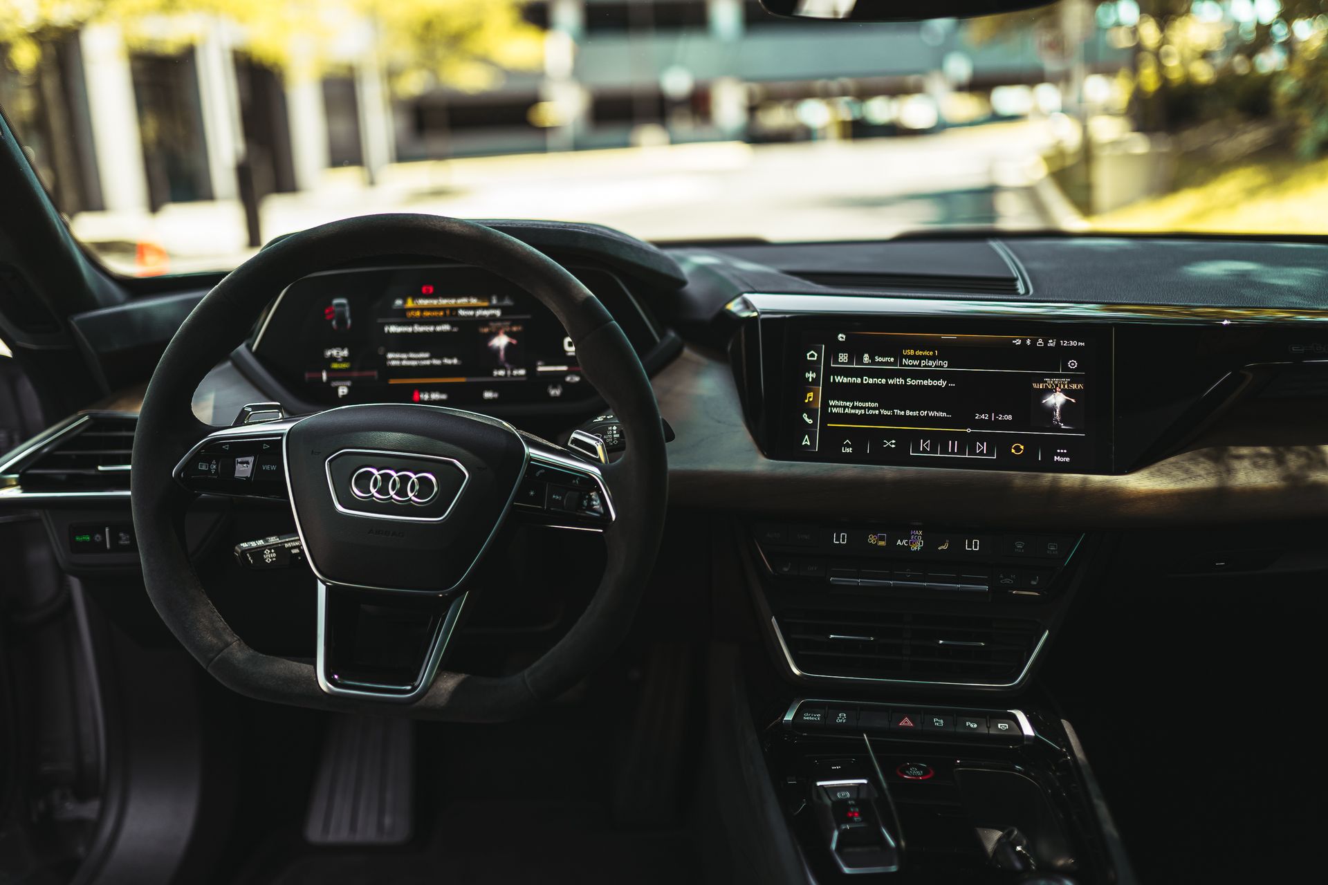 Explore a sleek and modern car interior featuring a digital dashboard and advanced steering controls.