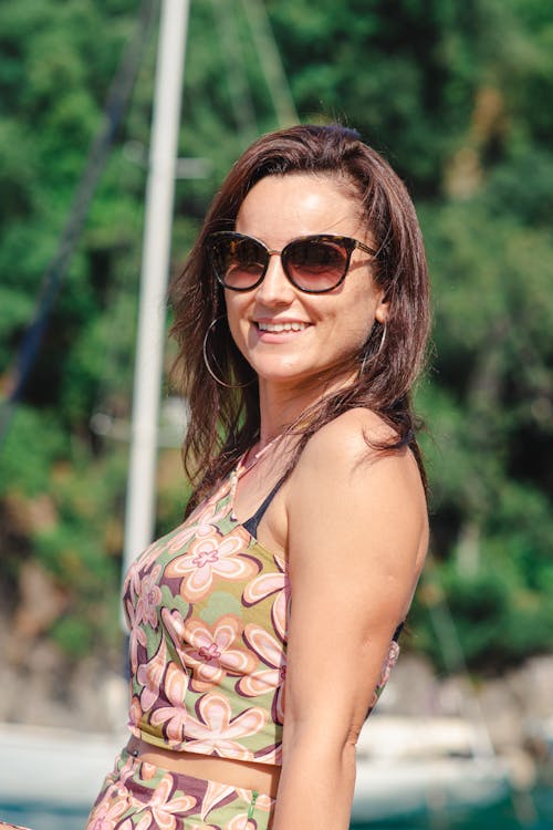 Woman in Floral Crop Top Wearing Sunglasses