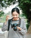 A Woman Holding a Camera