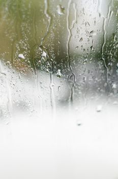A serene view of water droplets on a window, capturing the mood of a rainy autumn day in Moscow.