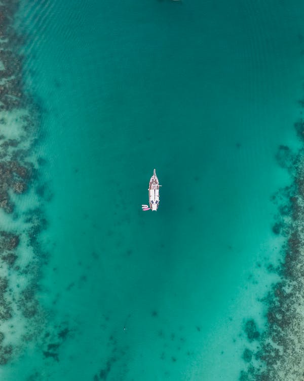 White Boat on Body of Water