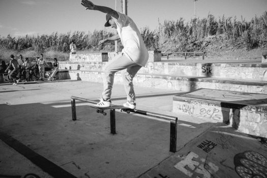 Man Doing Skateboarding Tricks in the Park