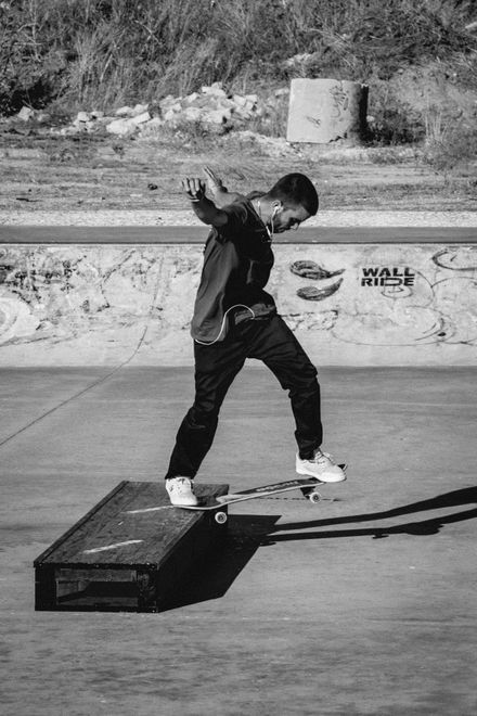 Skateboarder mid-trick in a concrete park — photo by Yuri Barreto on Pexels