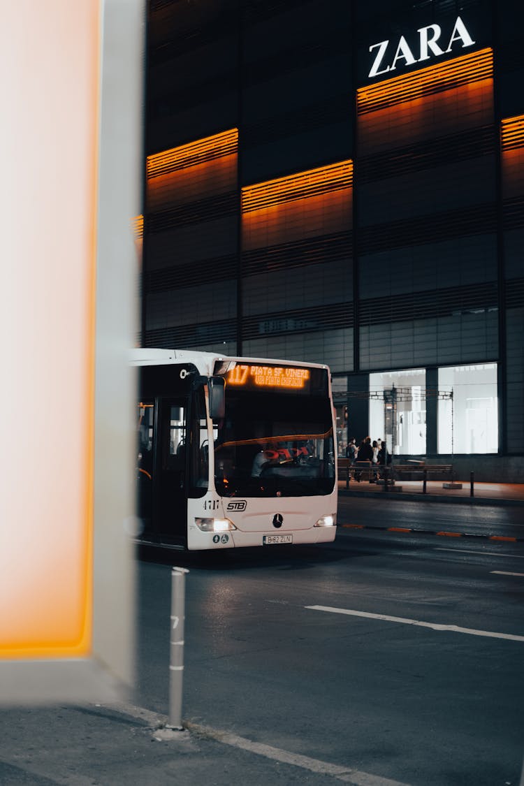 White Bus On Road During Night Time