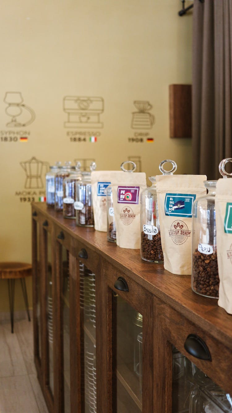 Coffee Packages And Jars In Row