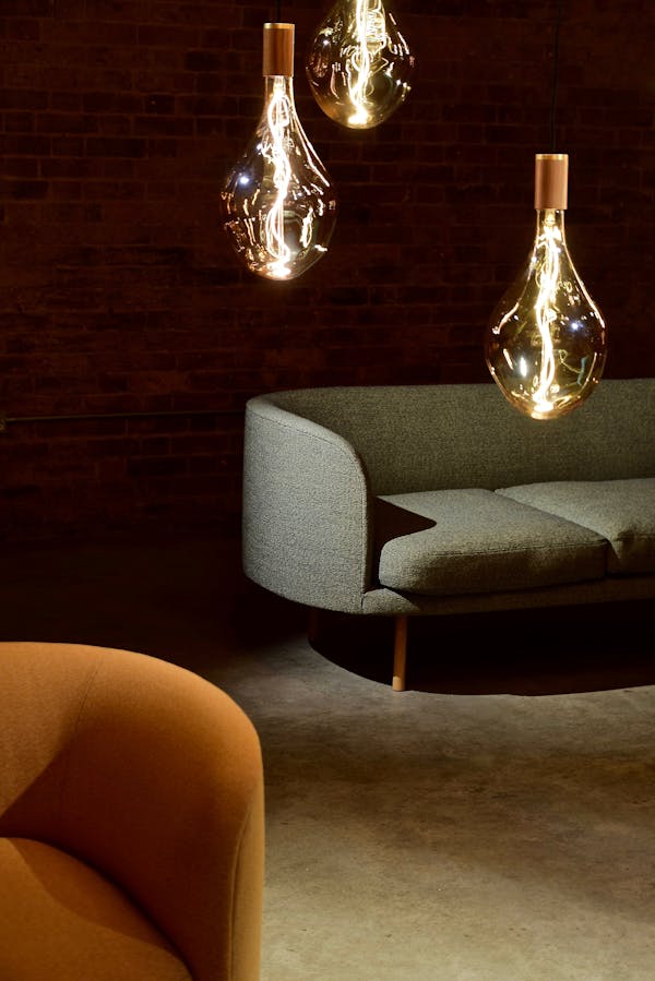 Three Edison Light Bulbs Beside the Sofa