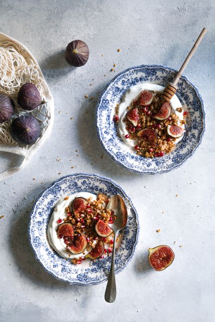 Top view of fig and granola bowls with yogurt, perfect for a healthy breakfast.