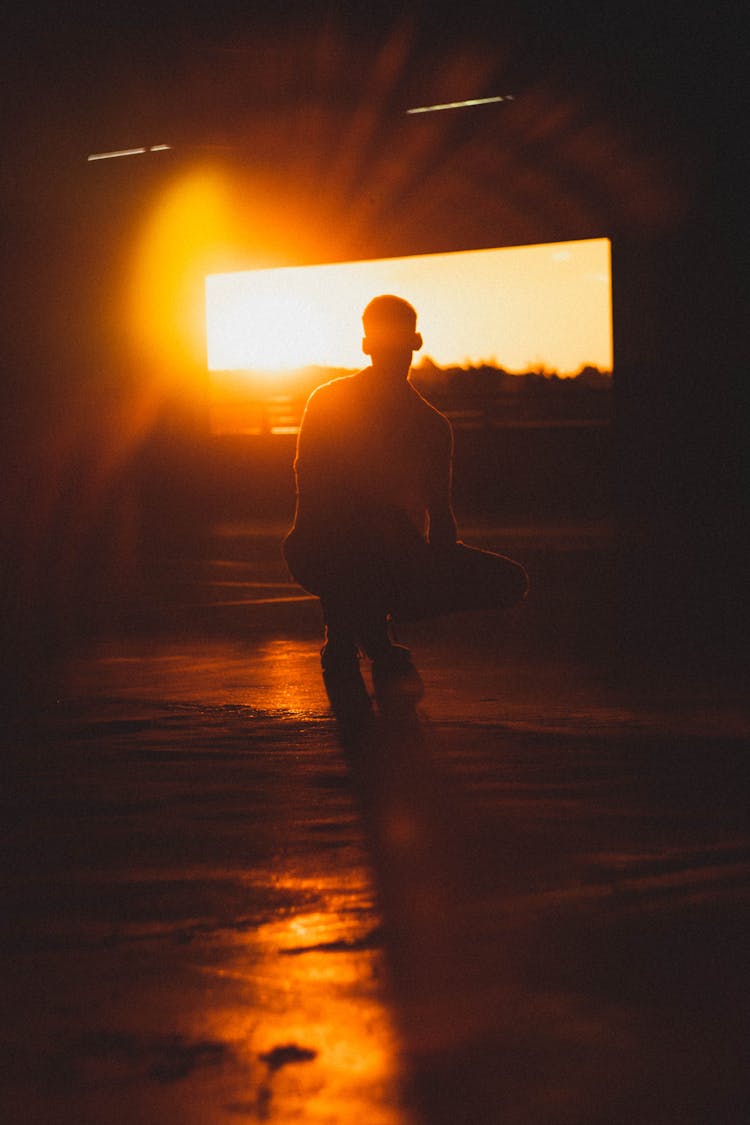 Silhouette Of A Crouching Man 