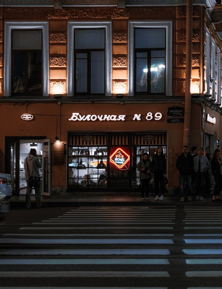 People On Crosswalk On Night City Street