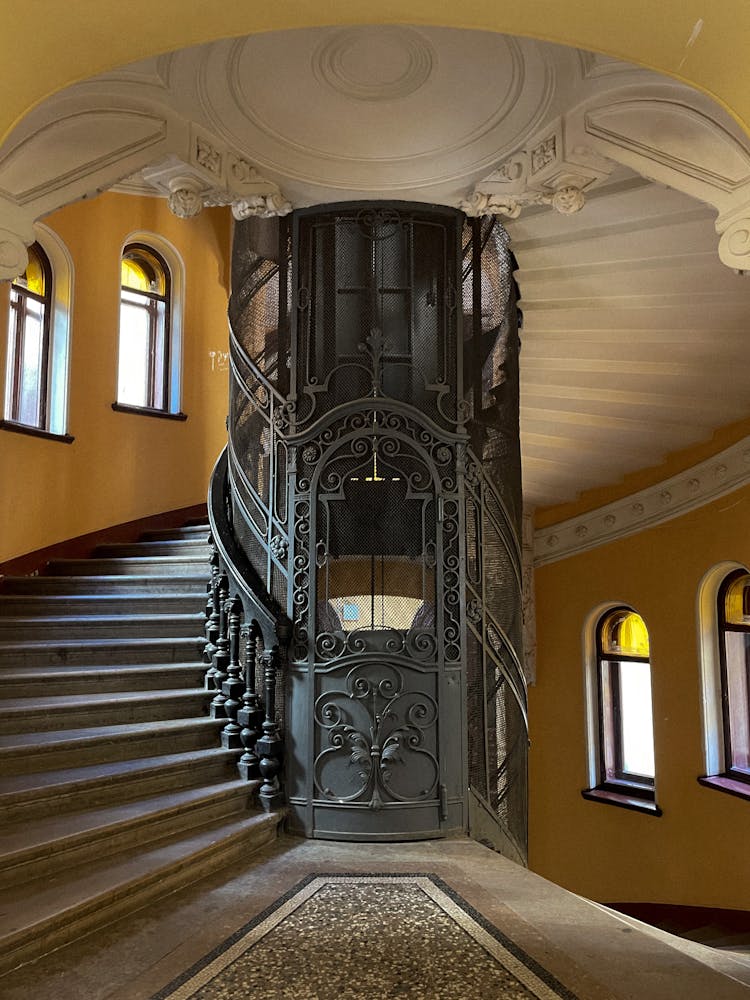 Staircase And Vintage Lift In Old Building