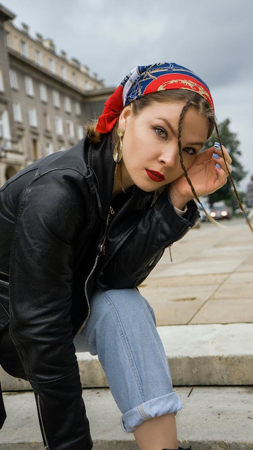 Woman in Black Leather Jacket Wearing Headscarf