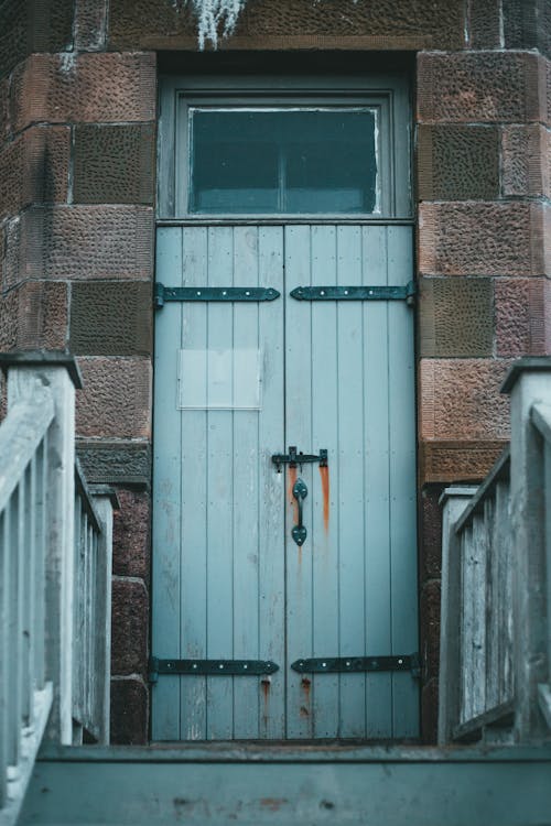 Free Wooden Door of a Building Stock Photo