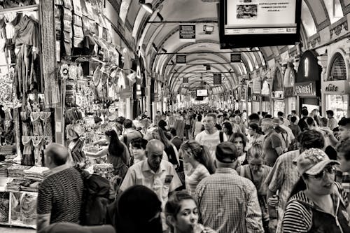 Grayscale Photo of People at Market