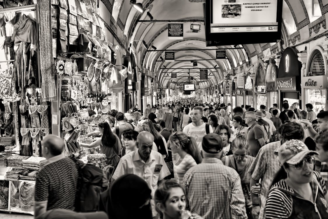 Grayscale Photo of People at Market