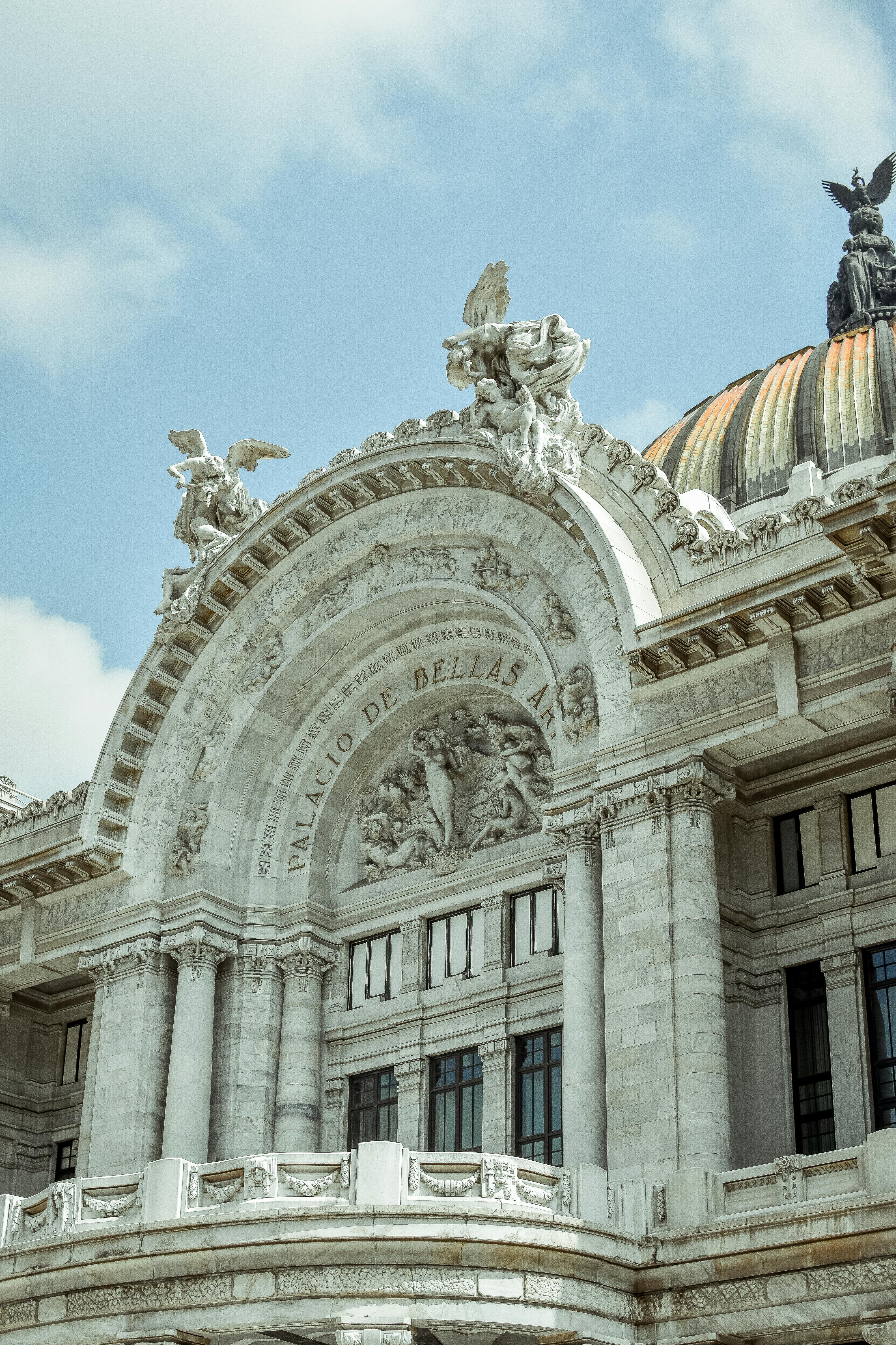 palacio de bellas artes under cloudy sky