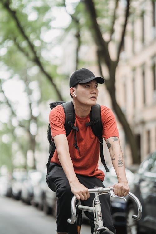 Безкоштовне стокове фото на тему «азіатський чоловік, велосипед, вертикальні постріл»
