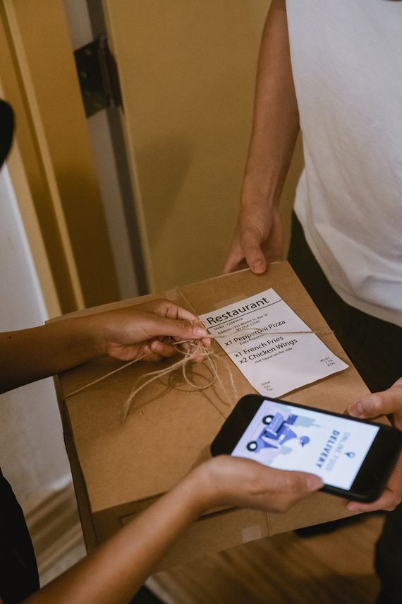 Package delivery being confirmed with a smartphone