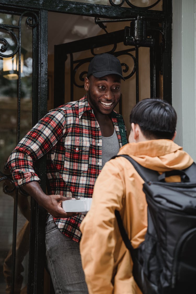 Man Picking Up Order From Deliveryman