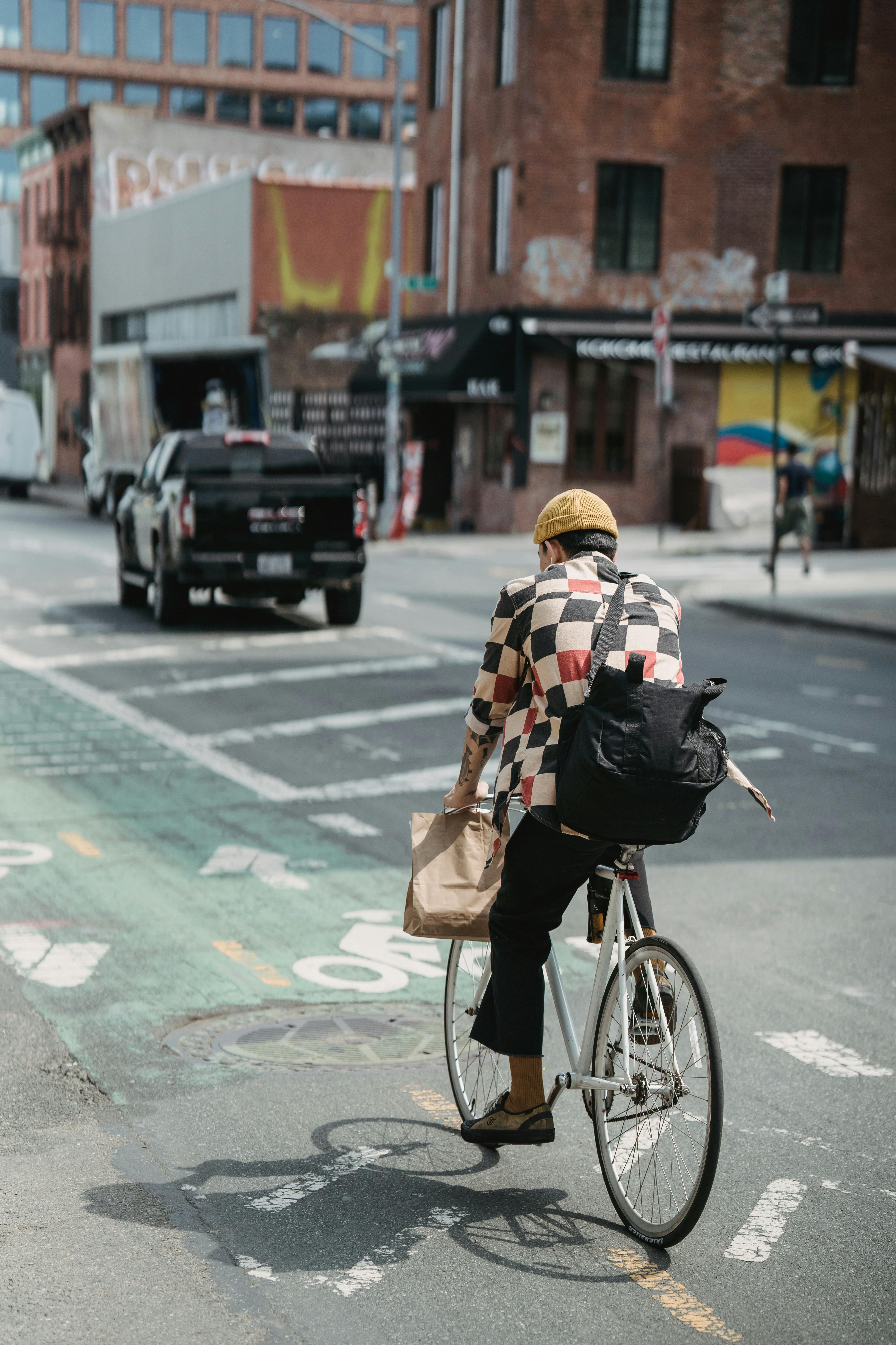 a man riding bicycle on the street