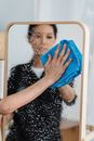 A Person Wiping a Wet Mirror