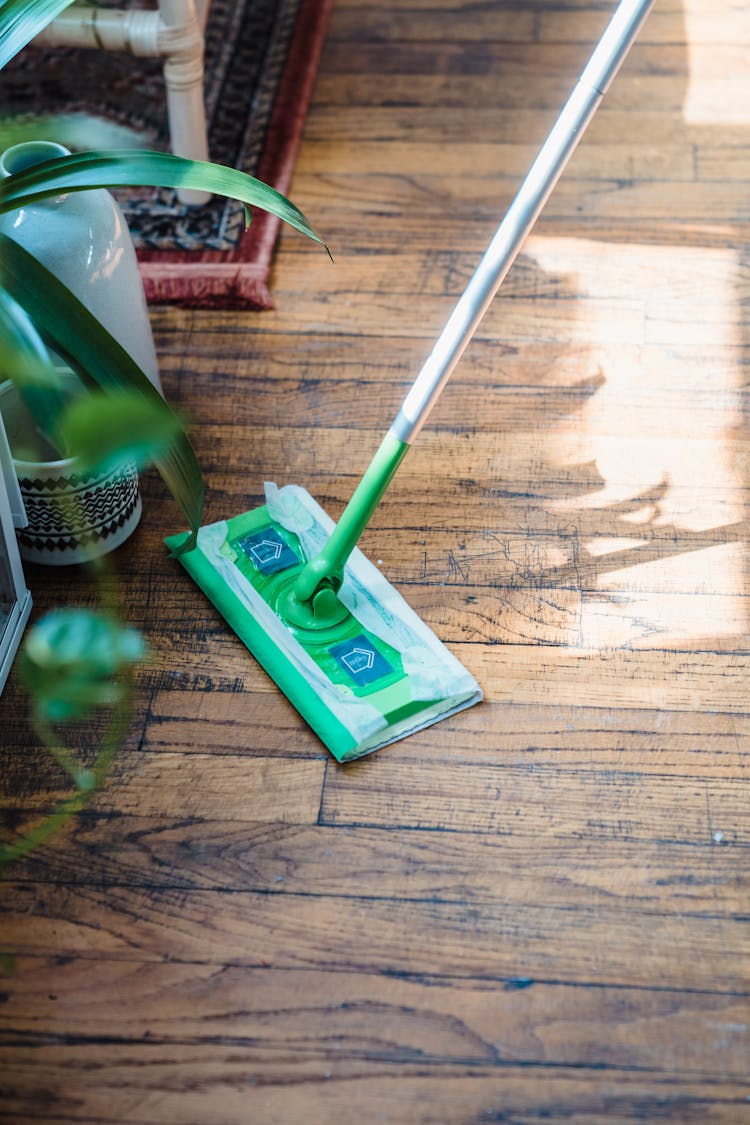 A Person Cleaning The Floor