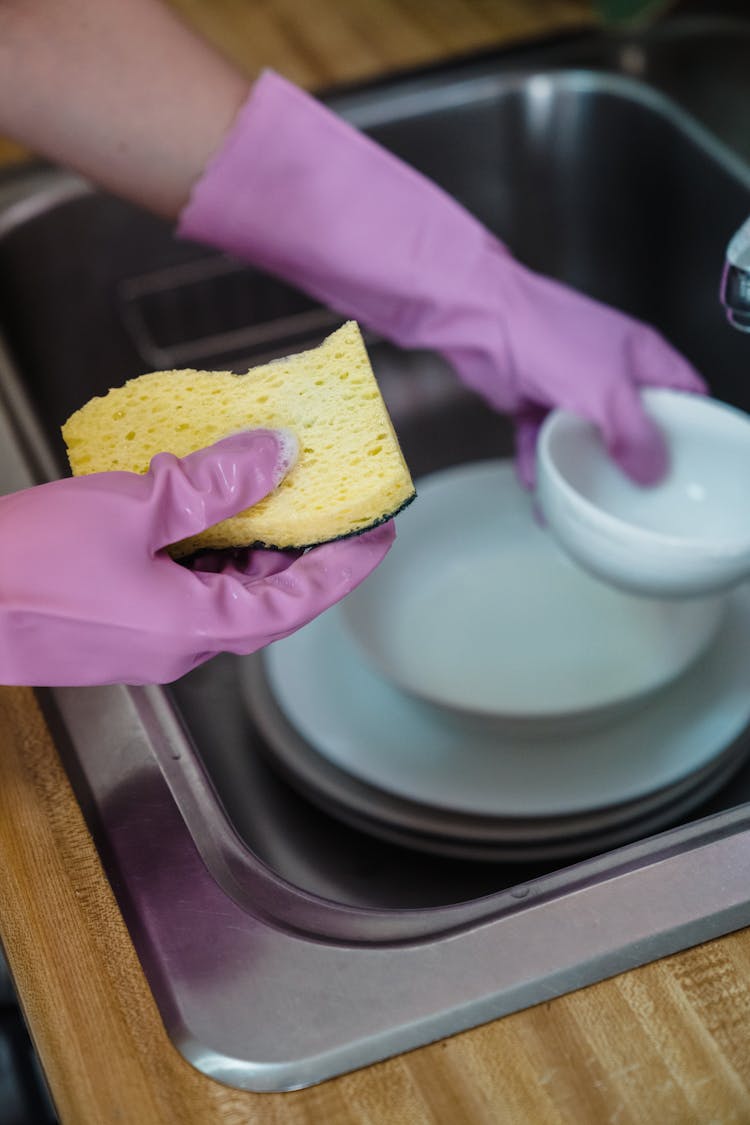 A Person Washing Dishes