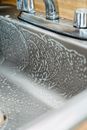 Close-up of a Soapy Kitchen Sink