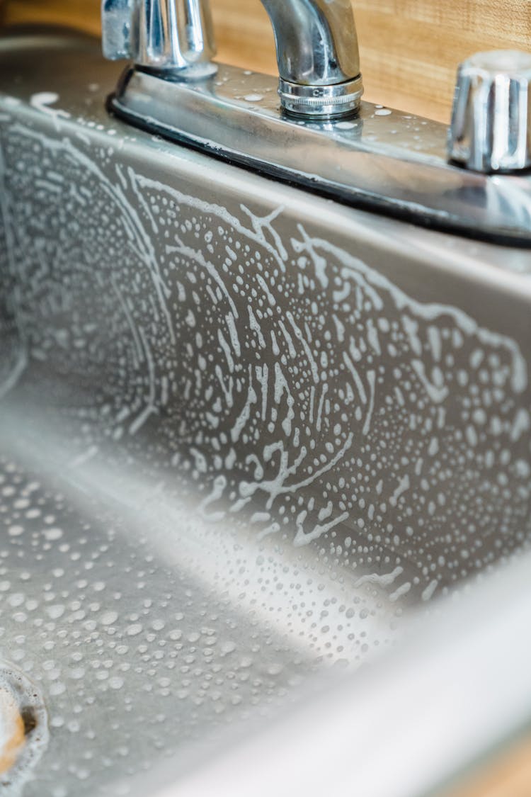 Close-up Of A Soapy Kitchen Sink