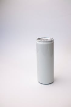Simple and clean mockup of a blank white can on a neutral background, ideal for branding projects.