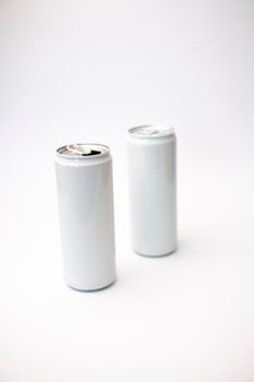 Two blank white cans on a plain background, ideal for branding or mockup use.