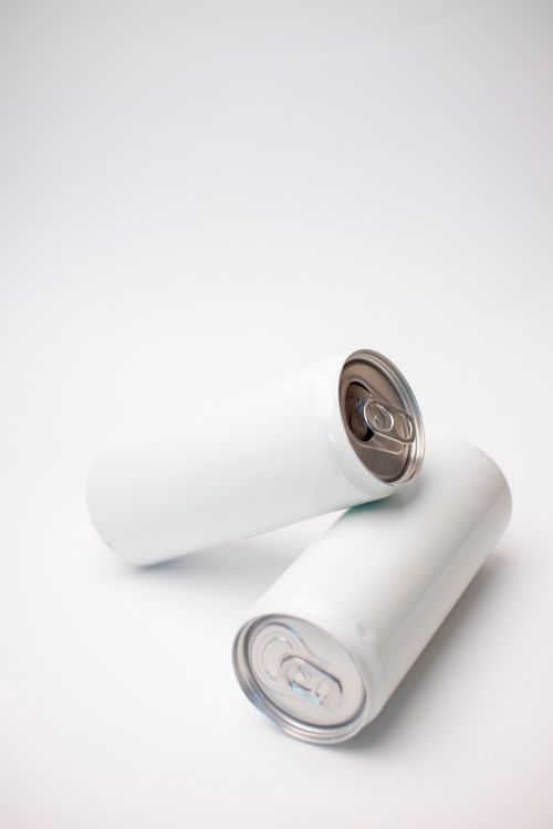 Sample product photo of two unlabelled slim drink cans — photo by Lesya Terekhova on Pexels