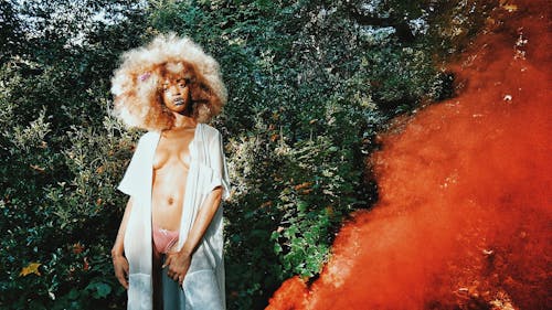 Selective Focus Photography of Woman Topless Standing Near Trees