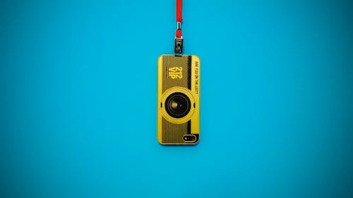 Yellow 212 Vip Camera Hanging on Blue Wall