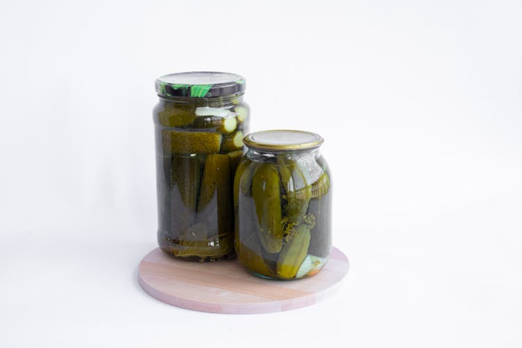 Pickled Cucumbers On Glass Jars