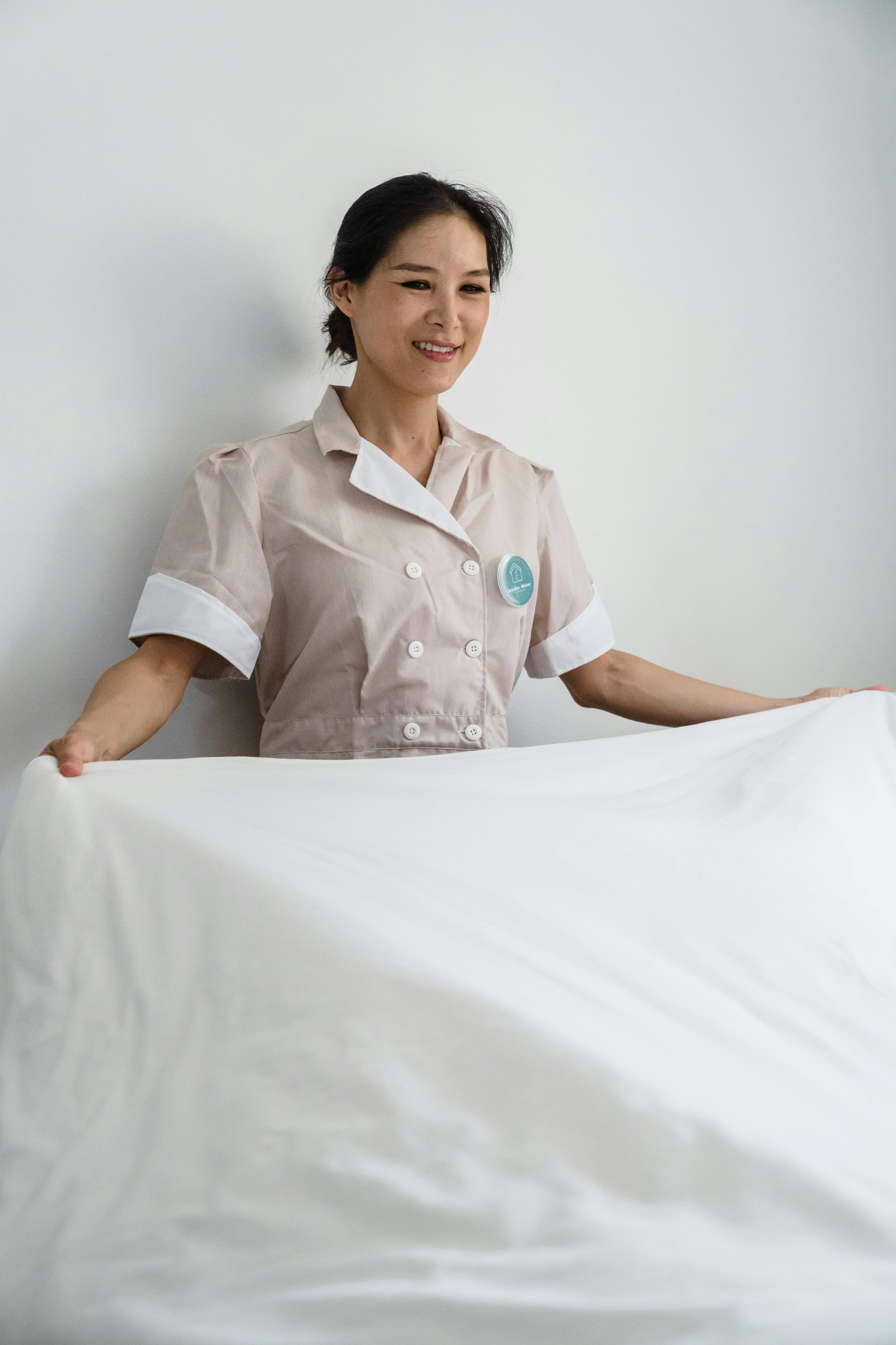 Cropped View Housemaid White Bed Sheets Laundry Stock Photo by