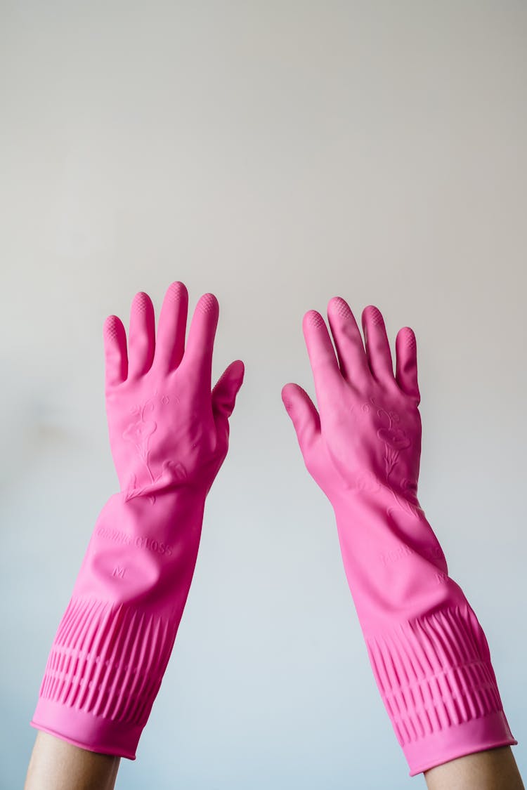 Hands In Pink Rubber Gloves On White Background