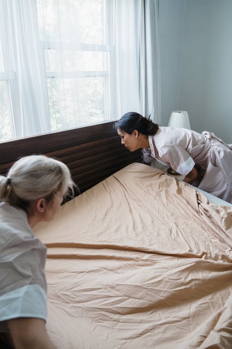 Hotel Maids Changing Bed Sheets